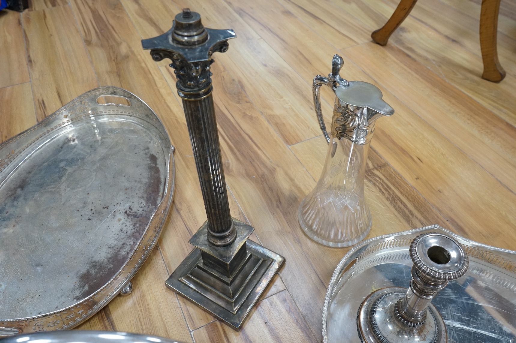 A collection of various silver plated wares including an Art Nouveau claret jug, trays, Corinthian column table lamp etc. Condition - varies